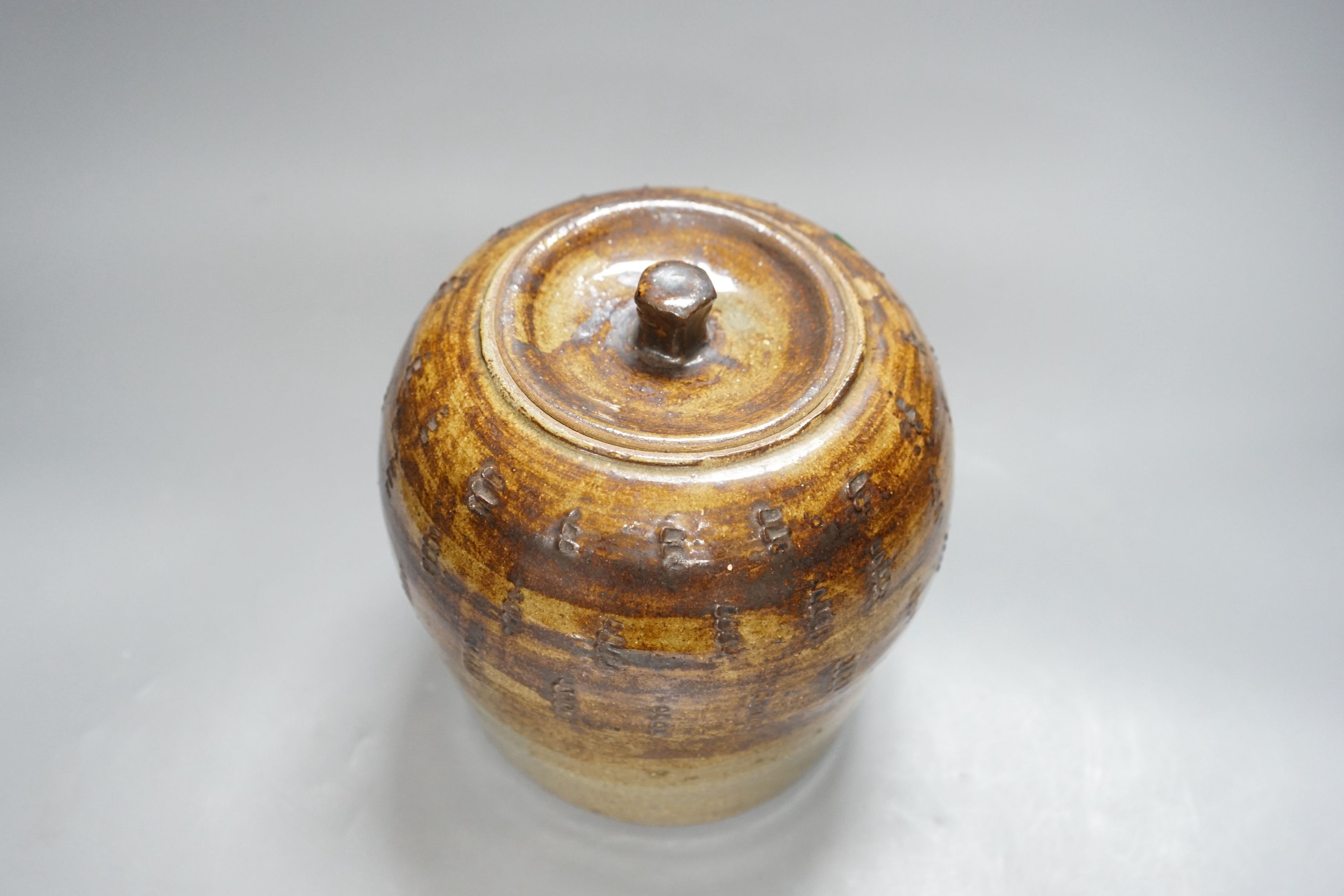 William Marshall (1923–2007), a brown glazed stoneware jar and cover, impressed mark, 22cm tall